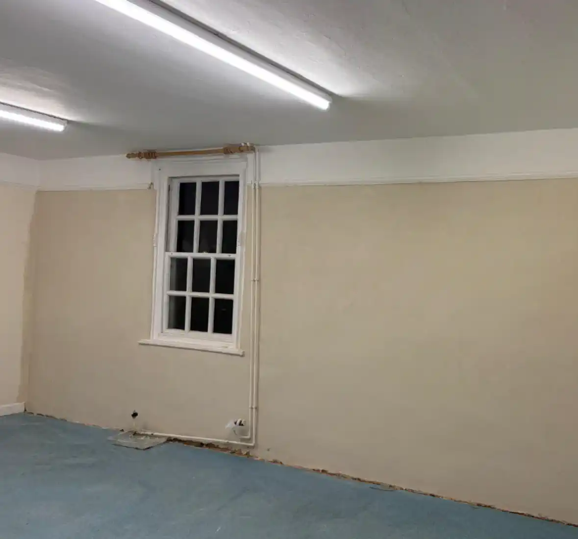 Repaired lime plaster over brickwork